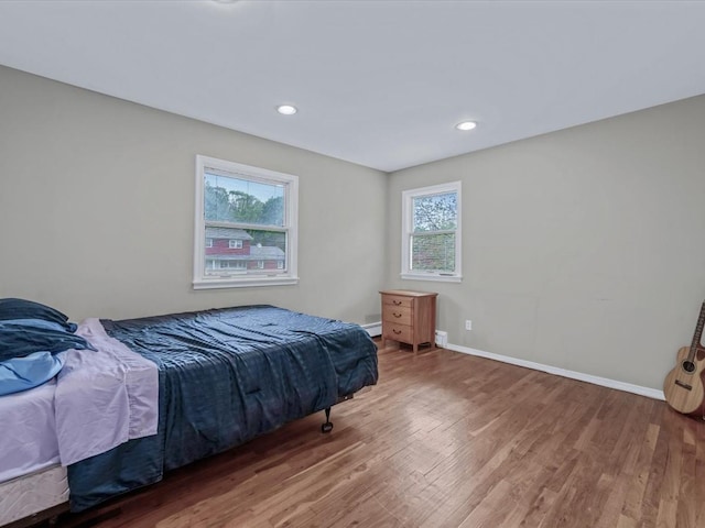 9 Cresthill Pl, Smithtown, NY 11787 - bedroom featuring wood finished floors, baseboards, and recessed lighting