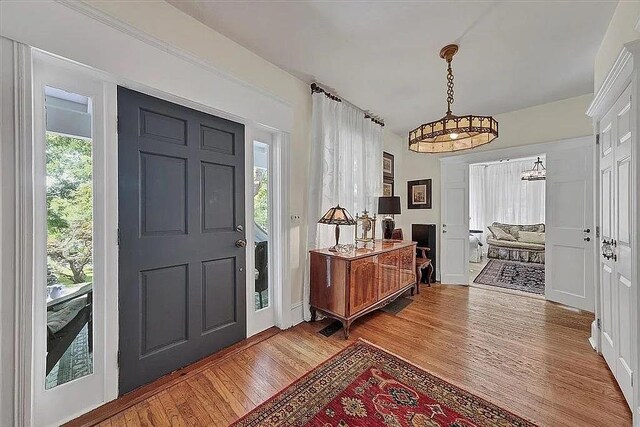 foyer entrance with light wood-style floors