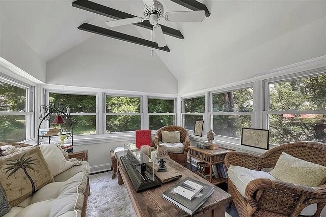 sunroom / solarium with high vaulted ceiling