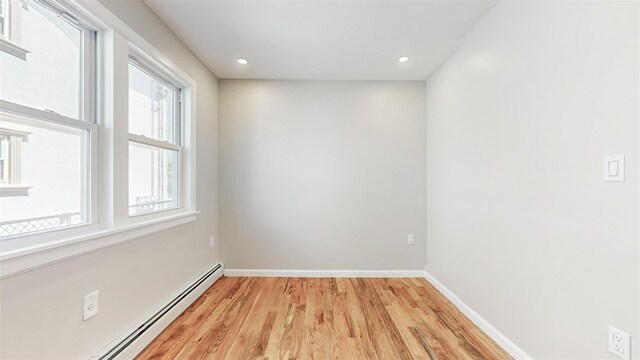 13108 160th St, Jamaica, NY 11434 - spare room featuring a baseboard radiator, light wood finished floors, baseboards, and recessed lighting