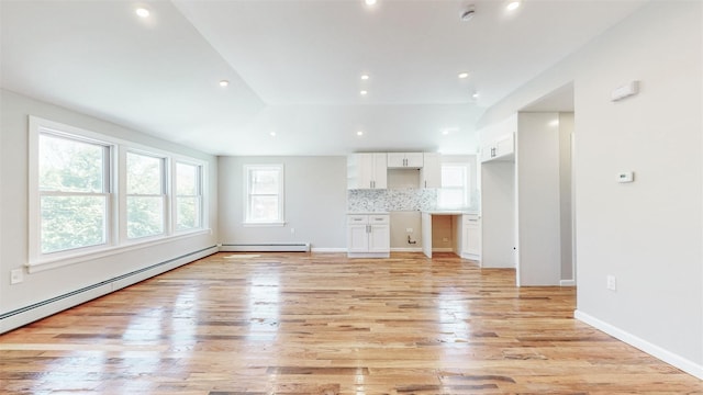 13108 160th St, Jamaica, NY 11434 - unfurnished living room featuring light wood-style flooring, a baseboard radiator, recessed lighting, and baseboards