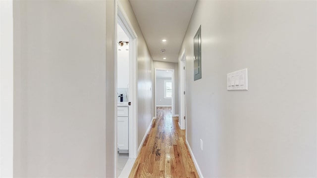 13108 160th St, Jamaica, NY 11434 - corridor featuring light wood-style flooring, baseboards, recessed lighting, and electric panel
