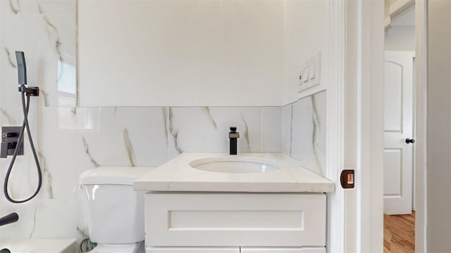 13108 160th St, Jamaica, NY 11434 - bathroom with vanity, wood finished floors, and toilet