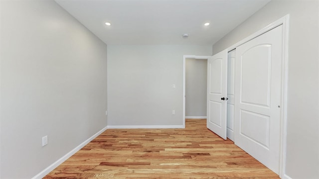 13108 160th St, Jamaica, NY 11434 - unfurnished bedroom with light wood-type flooring, recessed lighting, baseboards, and a closet