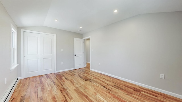 13108 160th St, Jamaica, NY 11434 - unfurnished bedroom with a baseboard radiator, lofted ceiling, light wood-type flooring, a closet, and baseboards