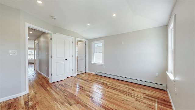 13108 160th St, Jamaica, NY 11434 - unfurnished bedroom featuring baseboard heating, vaulted ceiling, light wood-style floors, baseboards, and recessed lighting