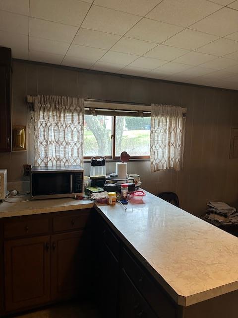 1 Rutland Dr, Patterson, NY 12563 - kitchen featuring stainless steel microwave, light countertops, and a peninsula