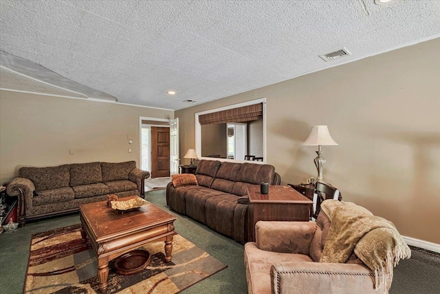 living area with carpet flooring, a textured ceiling, and visible vents