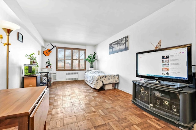 bedroom featuring radiator and baseboards