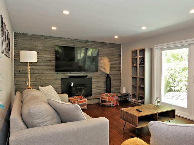 256 Macy Rd, Briarcliff Manor, NY 10510 - living room featuring a wood stove, wood walls, wood finished floors, recessed lighting, and a baseboard heating unit