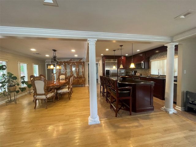 79 Constellation Rd, Levittown, NY 11756 - bar featuring stainless steel appliances, decorative columns, ornamental molding, light wood-type flooring, and decorative light fixtures