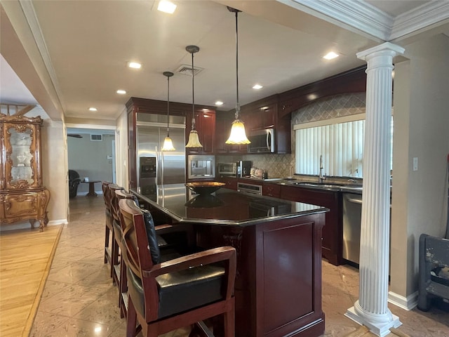 79 Constellation Rd, Levittown, NY 11756 - kitchen with ornate columns, stainless steel appliances, dark countertops, tasteful backsplash, and a breakfast bar