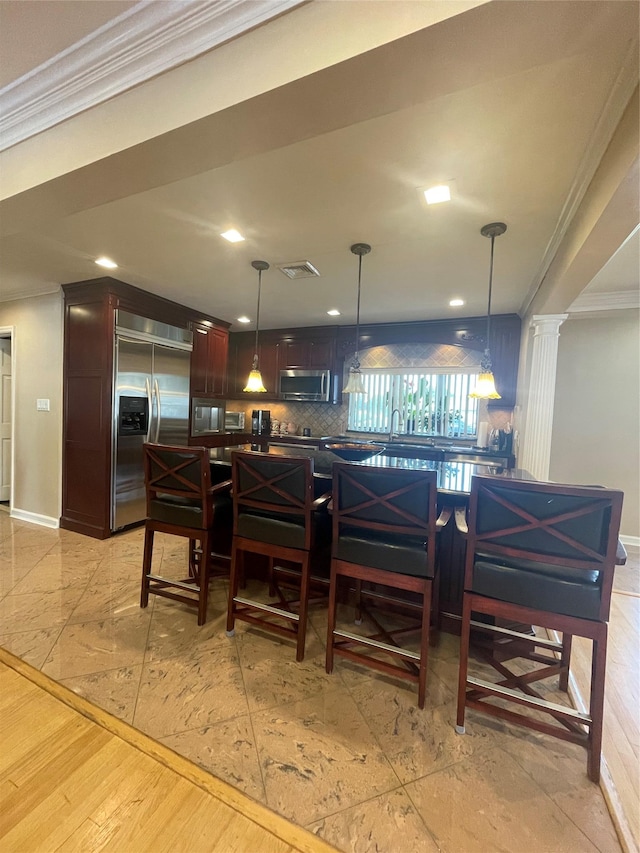 79 Constellation Rd, Levittown, NY 11756 - kitchen with built in appliances, ornamental molding, recessed lighting, tasteful backsplash, and hanging light fixtures