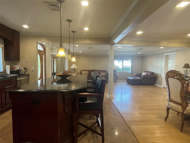 79 Constellation Rd, Levittown, NY 11756 - kitchen with ornate columns, dark countertops, open floor plan, ornamental molding, and recessed lighting
