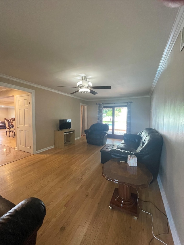 79 Constellation Rd, Levittown, NY 11756 - living room with wood finished floors, ceiling fan, and crown molding