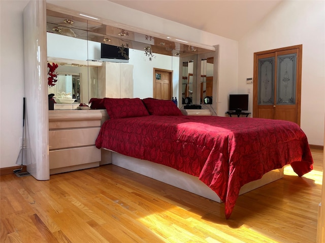 79 Constellation Rd, Levittown, NY 11756 - bedroom with light wood-type flooring and lofted ceiling