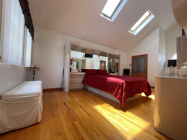 79 Constellation Rd, Levittown, NY 11756 - bedroom featuring a skylight, light wood-type flooring, high vaulted ceiling, and multiple windows