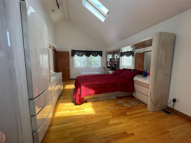 79 Constellation Rd, Levittown, NY 11756 - bedroom featuring high vaulted ceiling, light wood-type flooring, and a skylight