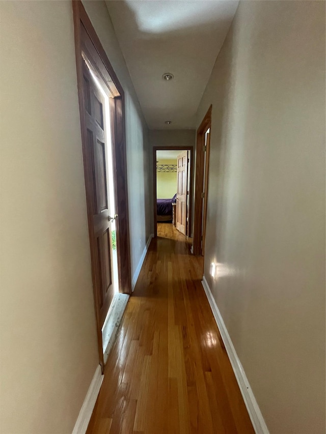 79 Constellation Rd, Levittown, NY 11756 - hall with baseboards and wood-type flooring
