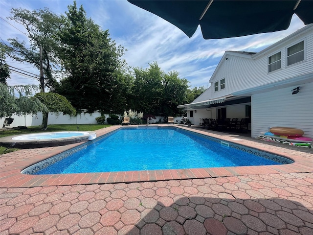 79 Constellation Rd, Levittown, NY 11756 - view of swimming pool with a patio area and a pool with connected hot tub