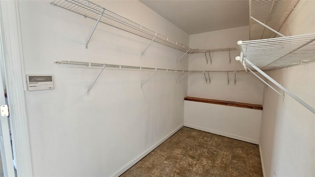 spacious closet featuring tile patterned floors