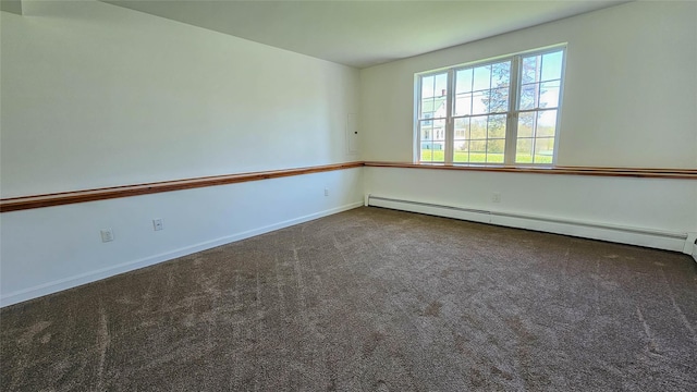 carpeted spare room featuring baseboards and baseboard heating