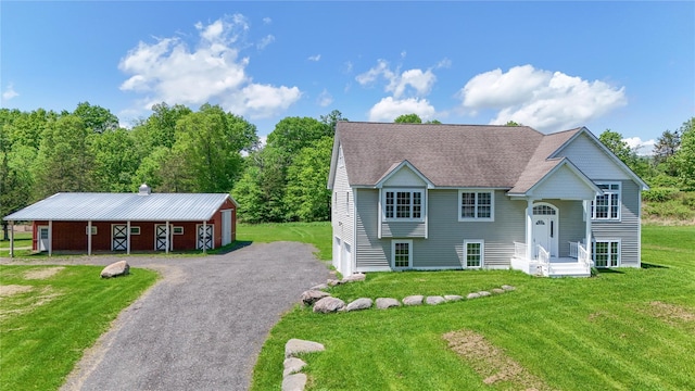 160 Pirog Rd, Pine Bush, NY 12566 - bi-level home with a front lawn, asphalt driveway, an outdoor structure, and roof with shingles
