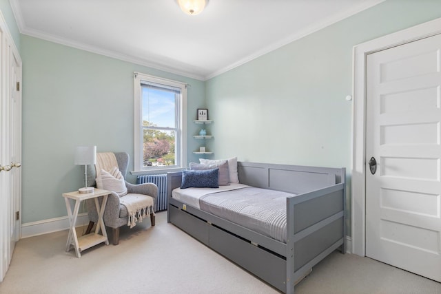 bedroom featuring radiator, ornamental molding, baseboards, and light colored carpet