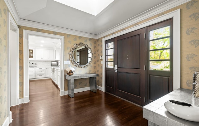 entryway featuring crown molding, wallpapered walls, and dark wood-style floors