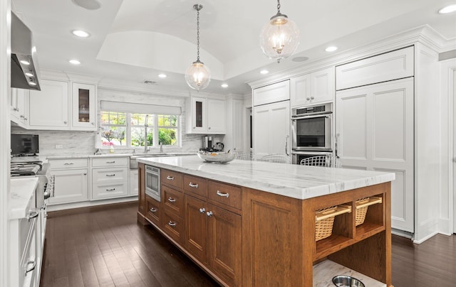 kitchen featuring white cabinetry, open shelves, vaulted ceiling, and glass insert cabinets