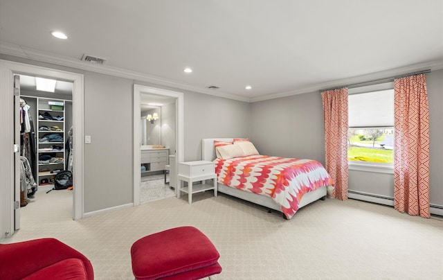 carpeted bedroom featuring crown molding, visible vents, a walk in closet, recessed lighting, and a baseboard heating unit