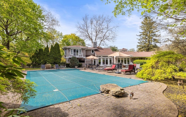 view of pool featuring a covered pool and a patio area