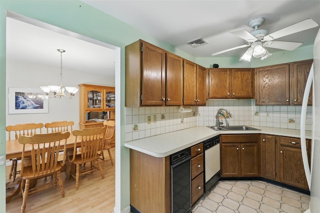 21 Lamplight St, Beacon, NY 12508 - kitchen featuring visible vents, white dishwasher, light countertops, tasteful backsplash, and a sink
