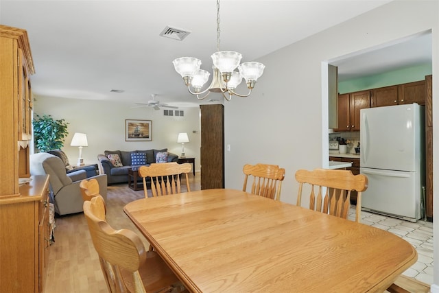 21 Lamplight St, Beacon, NY 12508 - dining space with visible vents and ceiling fan with notable chandelier