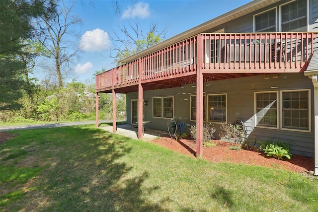 21 Lamplight St, Beacon, NY 12508 - back of property with a yard and a deck
