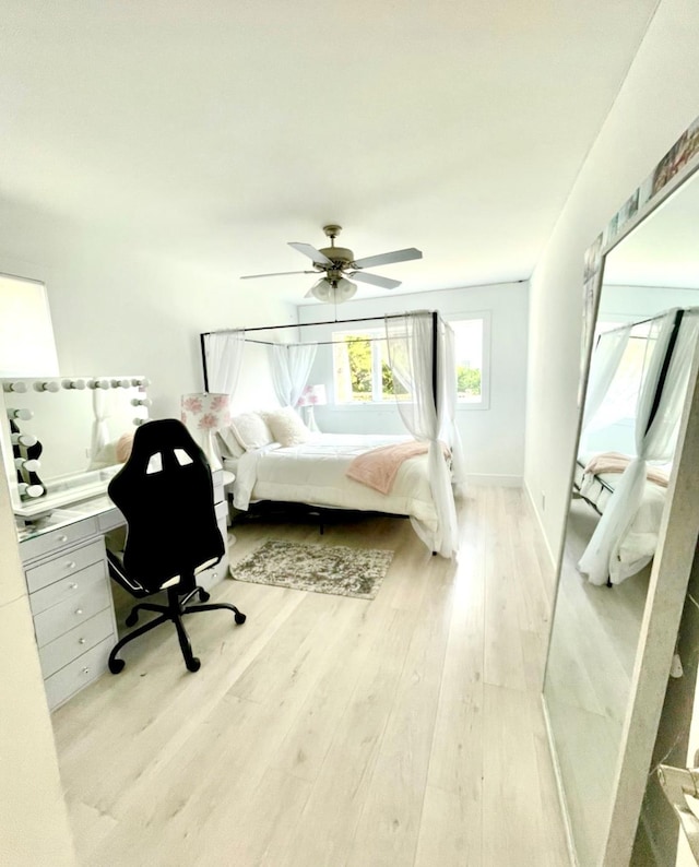 bedroom featuring a ceiling fan and wood finished floors