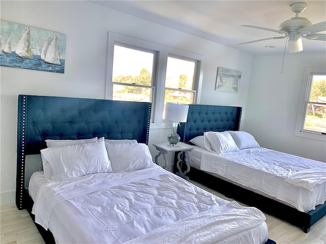 bedroom featuring ceiling fan and wood finished floors