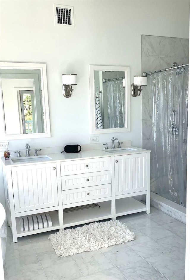 23 Nautilus Dr, Hampton Bays, NY 11946 - full bathroom with marble finish flooring, a shower stall, and double vanity