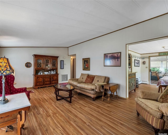 1407-54 Middle Rd Unit 54, Calverton, NY 11933 - living room featuring visible vents, crown molding, lofted ceiling, baseboard heating, and light wood-style flooring