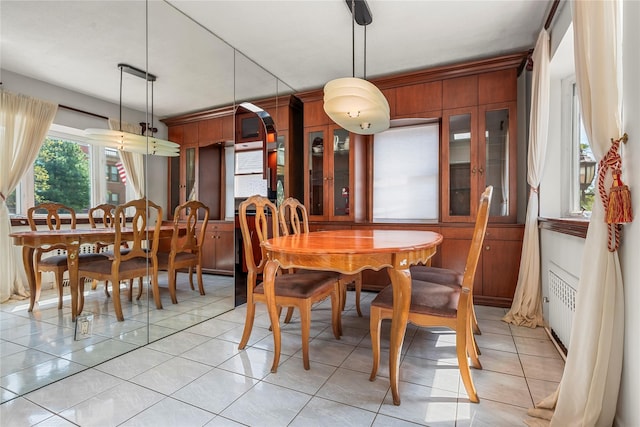 dining area featuring light tile patterned floors
