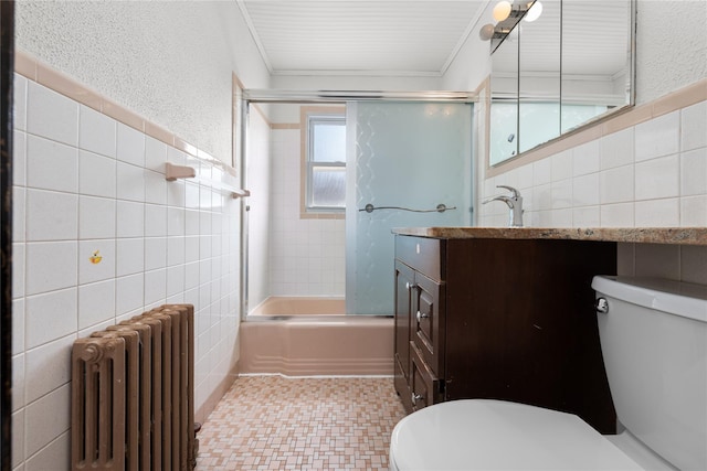 bathroom with radiator heating unit, tile walls, and toilet
