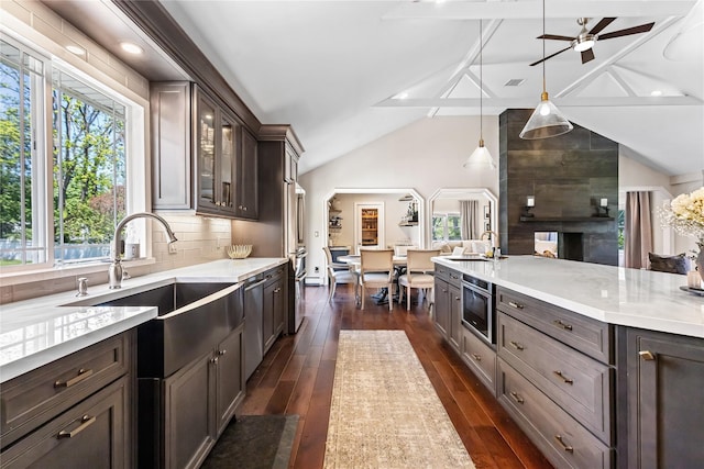 2307 Hawthorne Dr, Yorktown Heights, NY 10598 - kitchen with lofted ceiling, a sink, ceiling fan, dark wood-style flooring, and glass insert cabinets