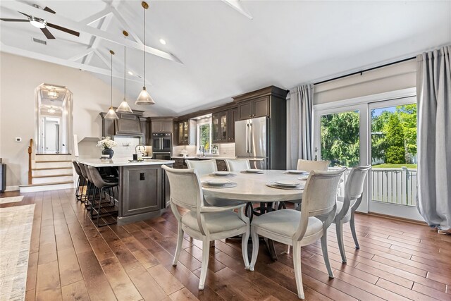 2307 Hawthorne Dr, Yorktown Heights, NY 10598 - dining space featuring dark wood-style floors, a ceiling fan, beam ceiling, and high vaulted ceiling