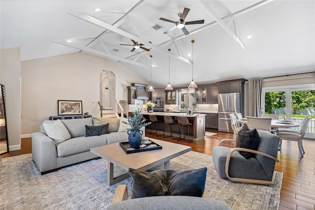 2307 Hawthorne Dr, Yorktown Heights, NY 10598 - living area with wood finished floors, ceiling fan, recessed lighting, beam ceiling, and high vaulted ceiling