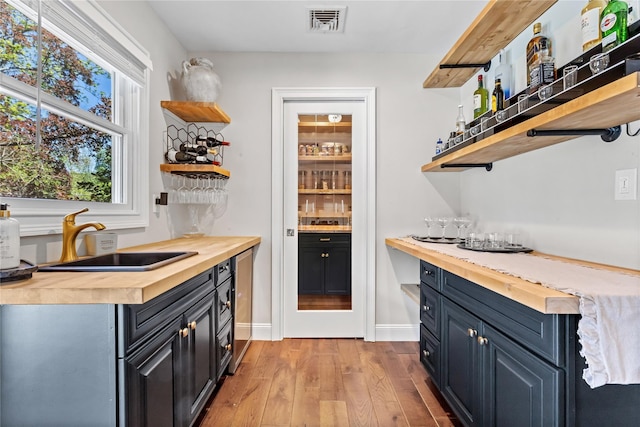 2307 Hawthorne Dr, Yorktown Heights, NY 10598 - indoor bar with light wood-style flooring and baseboards