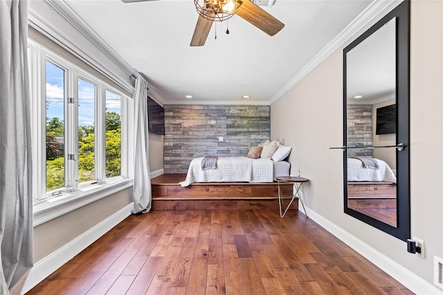 2307 Hawthorne Dr, Yorktown Heights, NY 10598 - bedroom featuring baseboards, wood-type flooring, an accent wall, recessed lighting, and crown molding