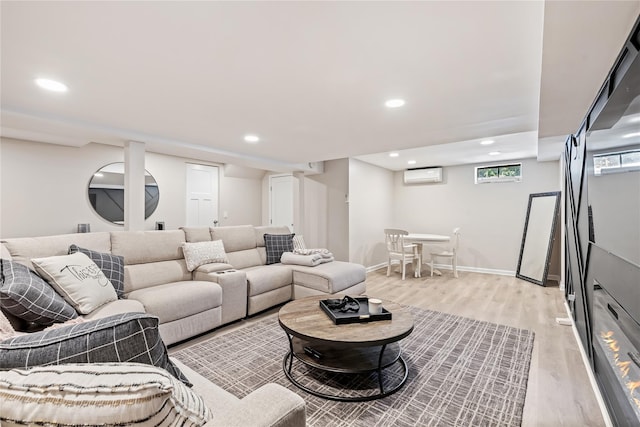 2307 Hawthorne Dr, Yorktown Heights, NY 10598 - living area with a wall mounted AC, light wood finished floors, recessed lighting, and baseboards