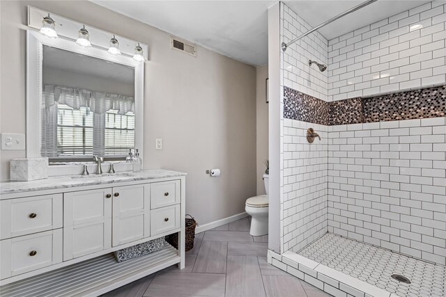 2307 Hawthorne Dr, Yorktown Heights, NY 10598 - bathroom with a stall shower, toilet, vanity, and baseboards