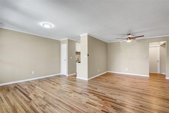 265 Artist Lake Dr, Middle Island, NY 11953 - interior space with crown molding, a ceiling fan, and light wood finished floors