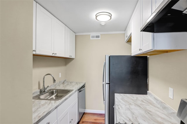265 Artist Lake Dr, Middle Island, NY 11953 - kitchen with visible vents, under cabinet range hood, white cabinets, a sink, and appliances with stainless steel finishes